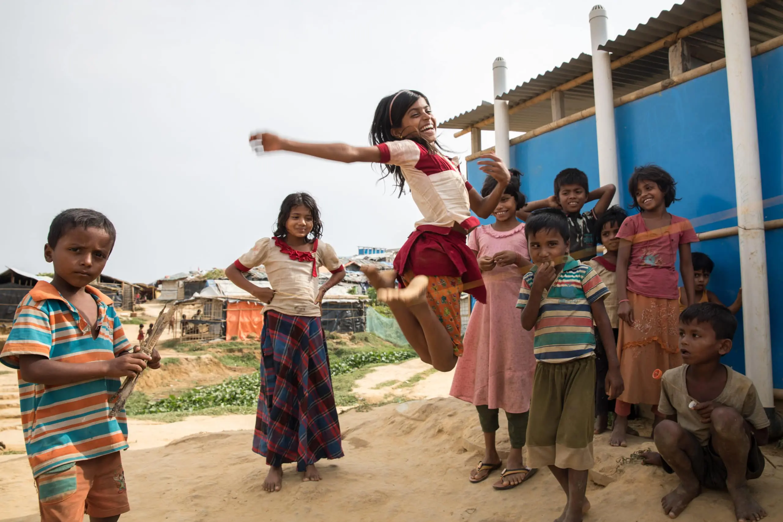 Children playing elastics in Kutupalong refugee camp.